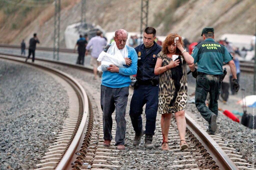 Victims receive help after a train crashed near Santiago de Compostela